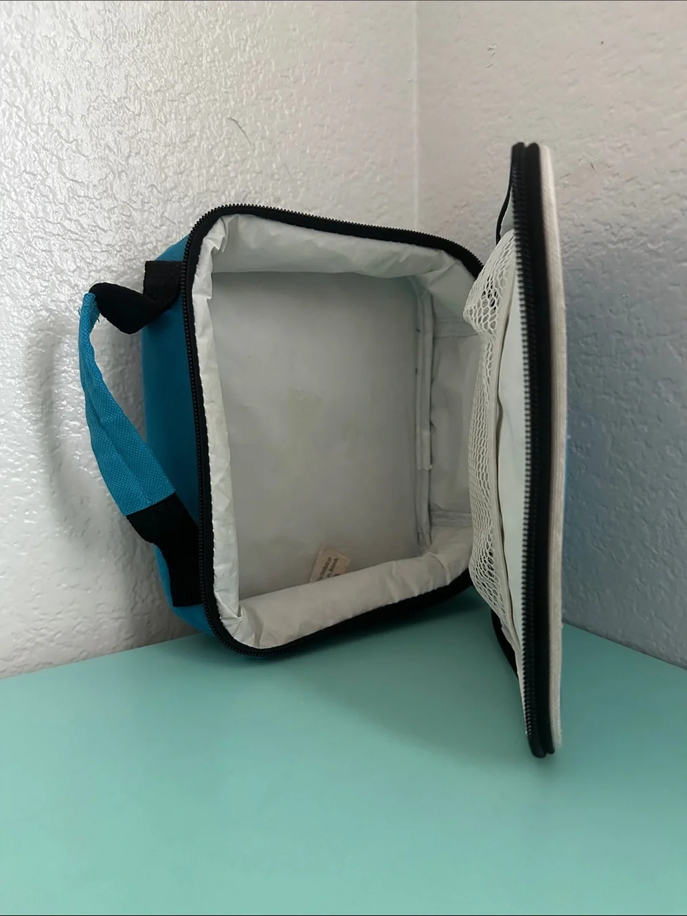 Walmart blue insulated lunch box with a minimalist white ’LUNCH’ graphic-used